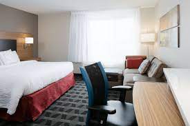 Towneplace Suites Kansas City Airport King Studio Suite Sleeping Area Guestroom Happy Holidays Suites Airport City Home