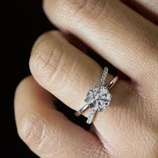 Clean Lines Of High Polished Precious Metal And Diamonds Make This Criss Cross Enga Criss Cross Engagement Ring Diamond Cluster Engagement Ring Engagement Sets