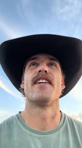 Guy in Cowboy Hat Helping with Boxes