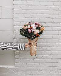 Saturday Blooms Medium Bouquet Assortment Wild Flowers Brown Paper Wrapped White Brick Pretty Flowers Flowers Flowers Bouquet