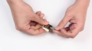 Hold the paperclip vertically and insert the curved end into the keyhole, which will push down on the pins inside. How To Pick A Lock Using A Paperclip 9 Steps With Pictures
