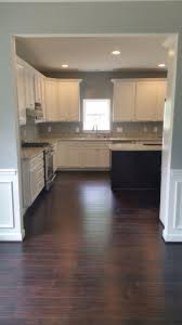 White Cabinets Colonial White Granite Grey Walls Dark Hardwood Stainless Steel Appliances White Granite Grey Kitchen Walls White Cabinets Grey Walls