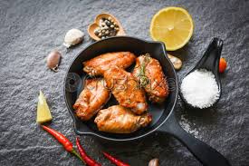 Drain on a wire rack over paper towels. Baked Chicken Wings With Sauce And Herbs And Spices Cooking Stock Photo Crushpixel