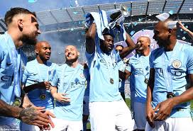 Manchester city will be forced to wait to lift the premier league trophy if they are crowned champions this weekend. Man City Lift Premier League Trophy After Ederson Moves Pitch Invaders Daily Mail Online