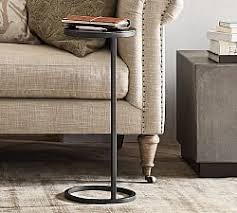 Built by hand from solid teak wood, it sports a circular wood slab tabletop with a base of intertwined sticks that creates an hourglass silhouette. Small Accent Table Pottery Barn