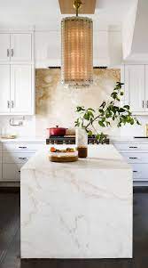 A backsplash isn't just tile on the wall, it has both form and function. 12 Onyx Kitchen Backsplash Ideas Luxury Look Try Onyx Onyx Kitchen Onyx Countertops Kitchen Modern Kitchen Backsplash