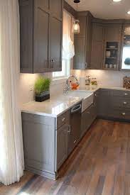 These grey kitchen cabinets have an elegant feel due to the feet on the sink cabinetry. Pin On House And Home