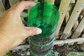 It includes instructions, as well as a templates for cutting openings as well as a template for adding a decorative label. How To Build A Vertical Garden From Soda Bottles With Pictures