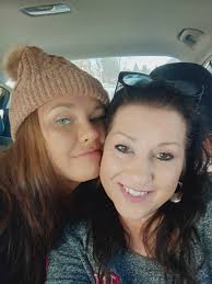 The woman with the red hair is Mrs. Russell, and that is her daughter