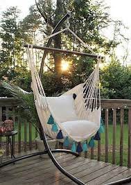 this macrame tassle hammock swing chair adds a fun seating area to any porch or patio tassel heaven dreamy swinging chair hammock swing chair outdoor hammock