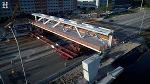 A pedestrian bridge collapsed onto a highway in washington, d.c., injuring fivepeople, officials say. Fiu Bridge That Collapsed Had Key Design Mistake Experts Say Miami Herald