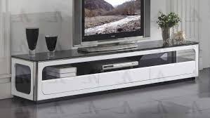 Couple sitting on couch together watching tv. Buy American Eagle Fc C511 Tv Stand In Black White Glass Wood Online