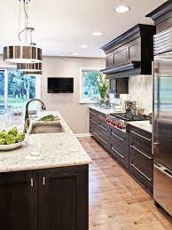It's time to go back to black with this striking modern farmhouse kitchen. Transitional Kitchen With Modern Dark Wood Cabinets Kitchen Designs Layout Beautiful Kitchens Beautiful Kitchen Designs