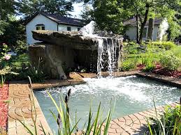 Adding landscaping around your rock waterfall is a fairly easy way of adding beauty, value, and style to your home's exterior. Pool Grotto Waterfall Formations Swimming Pool Waterfalls