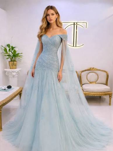 A dreamy powder blue gown adorned with delicate beadwork, flowing into a  soft tulle silhouette and finished with a graceful sheer cape. , BOOK US  NOW! , Call us on 📞 +971551250059, Send us a WhatsApp ...