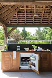 Outdoor Bbq Kitchen With Wolf Range Cooker Orchard House Humphrey Munson Rustic Outdoor Kitchens Outdoor Kitchen Decor Outdoor Kitchen Cabinets