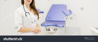 Professional Medical Physician Gynecologist Doctor In White Uniform In Clinic Hospital Gynecological Cabinet With Chair An In 2020 Gynecologists Medical Womens Health