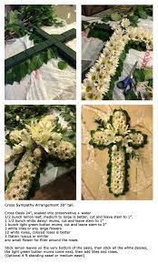 How do you make a funeral sheaf? How To Make Cross Sympathy Funeral Arrangement Funeral Flower Arrangements Funeral Floral Arrangements Funeral Flowers Diy