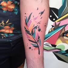 The shades of blue and yellow are mesmerizing and turn the leg into a canvas. Watercolor Feather Tattoo On The Forearm Tattoogrid Net