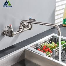 Wall mount faucets are usually used with a vessel sinks, not under mount sinks. Wall Mounted Long Spout Kitchen Sink Faucet Dual Handle Brushed Nickel Bathroom Kitchen Mixers Rotate Long Nose Hot Cold Taps Buy Swivel Spout Kitchen Sink Faucet Long Nose Spout Kitchen Mixer Tap Wall