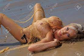 Sexy Beach Girl In Fishing Net Stock Photo, Picture and Royalty Free Image.  Image 17591367.