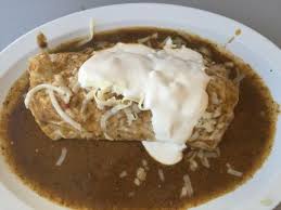 I've been eating chile rellenos and breakfast burritos my whole life, why have i never thought of i have dreams of eating burritos inside of another burrito. Chile Relleno Burrito Smothered Bild Von El Taco De Mexico Denver Tripadvisor