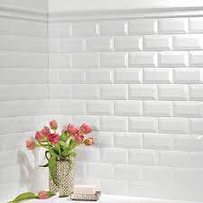 The chair rail perfectly complements a wainscoting design. Daltile Finesse Bright White 2 In X 6 In Ceramic Chair Rail Trim Tile 0 06 Sq Ft Piece Fe0126crcc1p The Home Depot White Beveled Subway Tile Beveled Subway Tile Backsplash Chair Rail