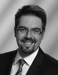 Coherent Conversion Between Microwave and Optical Photons—An Overview of  Physical Implementations