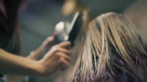 We haven't been around since 2003 simply because we have a knack for doing great hair. Woman With Long Blonde Hair Is Sitting In Hair Salon While Hairdresser Is Drying Her Wet Hair With Hair Dryer And Hairbrush Closeup Down Back Angle Slow Mo Stock Video C