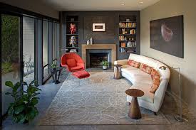 A cozy seating area in front of the fire with a chaise sectional. How To Find The Perfect Place For Your Curved Sofa Or Sectional