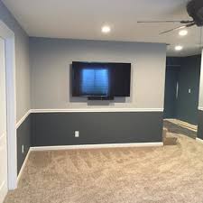 A fresh coat of white paint will make your space appear brighter and more inviting, while the wood paneling can add texture. Two Tone Basement Ideas Houzz