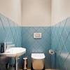 In this 5×8 bathroom remodel ideas, the floating shelves are used to neatly arrange the toiletries instead of a cubby cabinet. 3