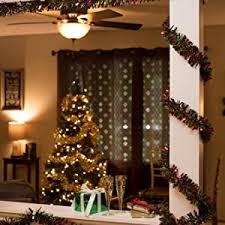 Another indoor christmas decoration idea that does not take much effort at all utilizes the furniture that is already established in your home and living space. Amazon Com Anderson S Red And Gold Metallic Tinsel Twist Garland 4 Inches Wide X 25 Ft Long Home Kitchen