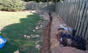 After digging your trench, fill it with a few inches of crushed stone. How To Install A French Drain The Home Depot