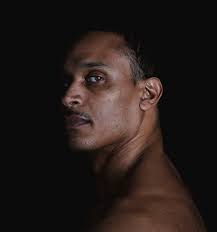 Portrait Of A Man On A Black Background by Michael Duva