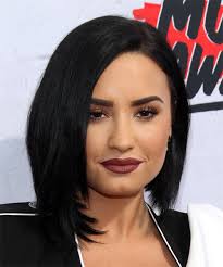 Demi lovato has done some major cropping with her latest outfit featuring a tight cropped top, a mini flared skirt, and a peekabo waist over those black stockings! Demi Lovato Medium Straight Black Bob Haircut