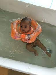 Ready within 2 hours with pickup. Baby Boy Swimming In A Bath Tub Stock Photo C91a7977 77db 4c50 Bc40 751f569a900c