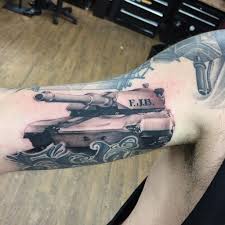 Grey ink army skull with helmet tattoo on shoulder. 41 Kickass Army Tattoos To Show Your Pride
