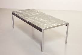 With a stained top, solid edges, and a black steel base, let this coffee table catch the eye of any wandering guest. Black Marble And Brushed Steel Coffee Table By Kho Liangh For Artifort 1960s For Sale At Pamono
