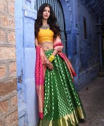 An Emerald Green Lehenga With A Yellow Blouse Pink Dupatta Is Love Lehenga Designs Mehendi Outfits Lehenga Images