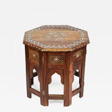 Individual pieces of mother of pearl or reliably sourced cow and camel bone have been skilfully carved and fixed into resin on a wooden frame to create these intricate designs. Anglo Indian Bone Inlaid Octagonal Side Table