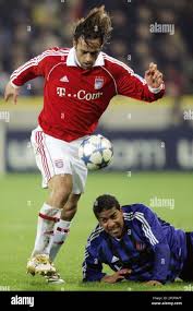 Munich's Iranian soccer player Ali Karimi, left, plays the ball ...