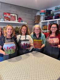 Lovely collection of felt baskets inspired by flowers and sunsets at this  wet felting