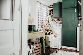 This laundry room features a vintage hotel sign and glass canisters for detergent and other essentials. Simple Cozy Farmhouse Laundry Room Decor Two Paws Farmhouse