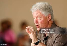 Former U.S. President Bill Clinton takes a photo with supporter... News  Photo