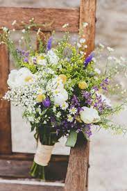 The groom made all of the wood elements that were incorporated into the day and the bride styled the tables with great vintage pieces. Pin By Katharina John On Wedding Flowers Purple Wedding Bouquets Wedding Flowers Wildflower Wedding