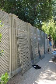 Decorative Treillage Installation Against A Wall In 2020 Backyard Fence Decor Fence Decor Backyard Fences