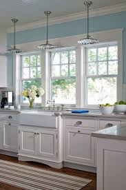 Country Kitchen With Flat Panel Cabinets Hardwood Floors Farmhouse Sink Pendant Light White Kitchen Interior White Kitchen Decor Modern Farmhouse Kitchens