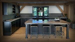 Add an industrial touch to your décor with raw wire designs, metal storage racks, and antique style wall cabinets, or introduce charming scandi style with wooden storage shelves, hooks and box units. The Workshop Kitchen Industrial Kitchen Handmade Uk Steel Vintage