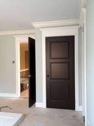 A front door in a natural wood stain or dark brown color will enhance the warmth of any front porch or entryway. Dark Doors White Trim Dark Doors White Trim Dark Doors Black Interior Doors